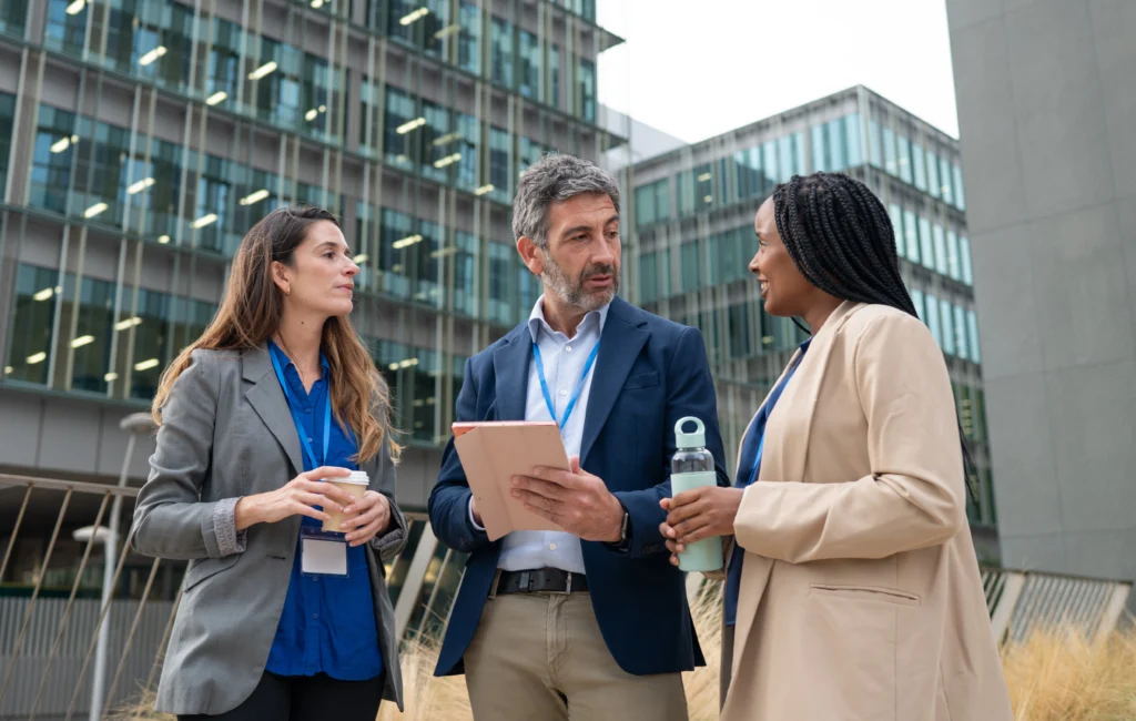 Coworkers discussing something outside